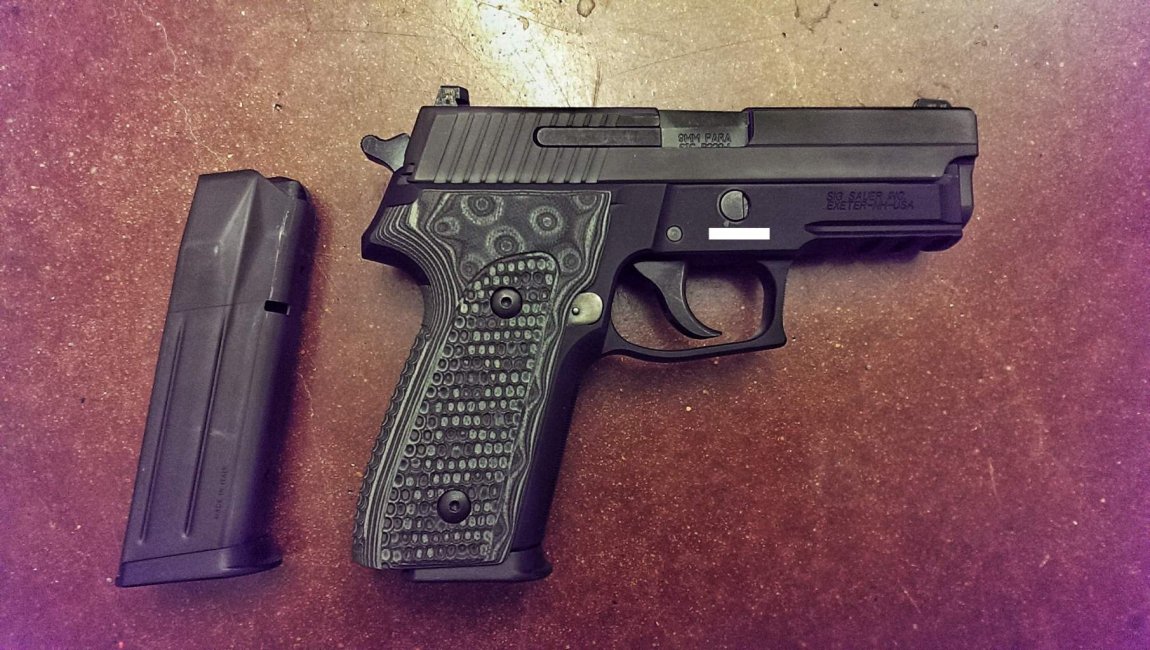 Sig P229 with G10 extreme grips.jpg