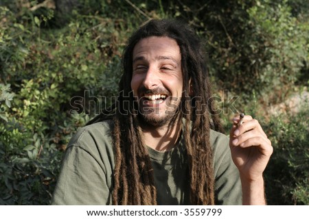 stock-photo-hippy-preparing-rolling-and-smoking-marijuana-joint-photos-series-3559799.jpg